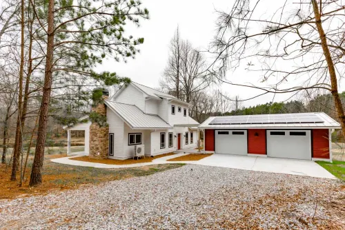 What Is a Heat Pump? house home family wood architecture building property real tree estate window outdoors driveway garage door winter exterior luxury roof
