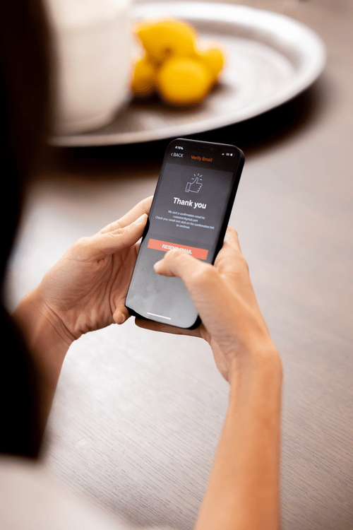 Woman using Kumo app on iPhone