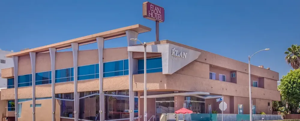 Élan Hotel architecture outdoors contemporary travel sky business luxury hotel family street glass items building blue sky modern facade house wood balcony