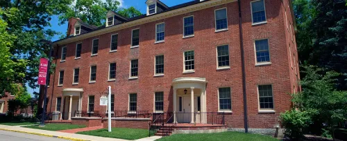 Miami University's Elliot Hall and Stoddard Hall home architecture house building family brick window yard facade estate street residential lawn mortgage roof construction exterior class mansion door